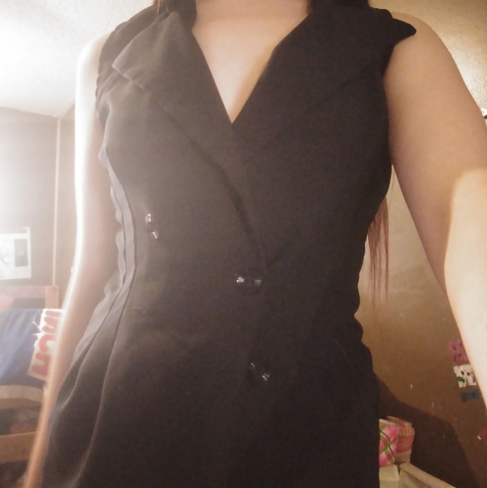 Woman's black sleeveless suit jacket/vest